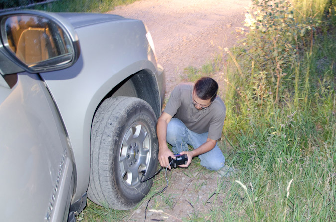 Fixing the flat tire on Rock of Ages road